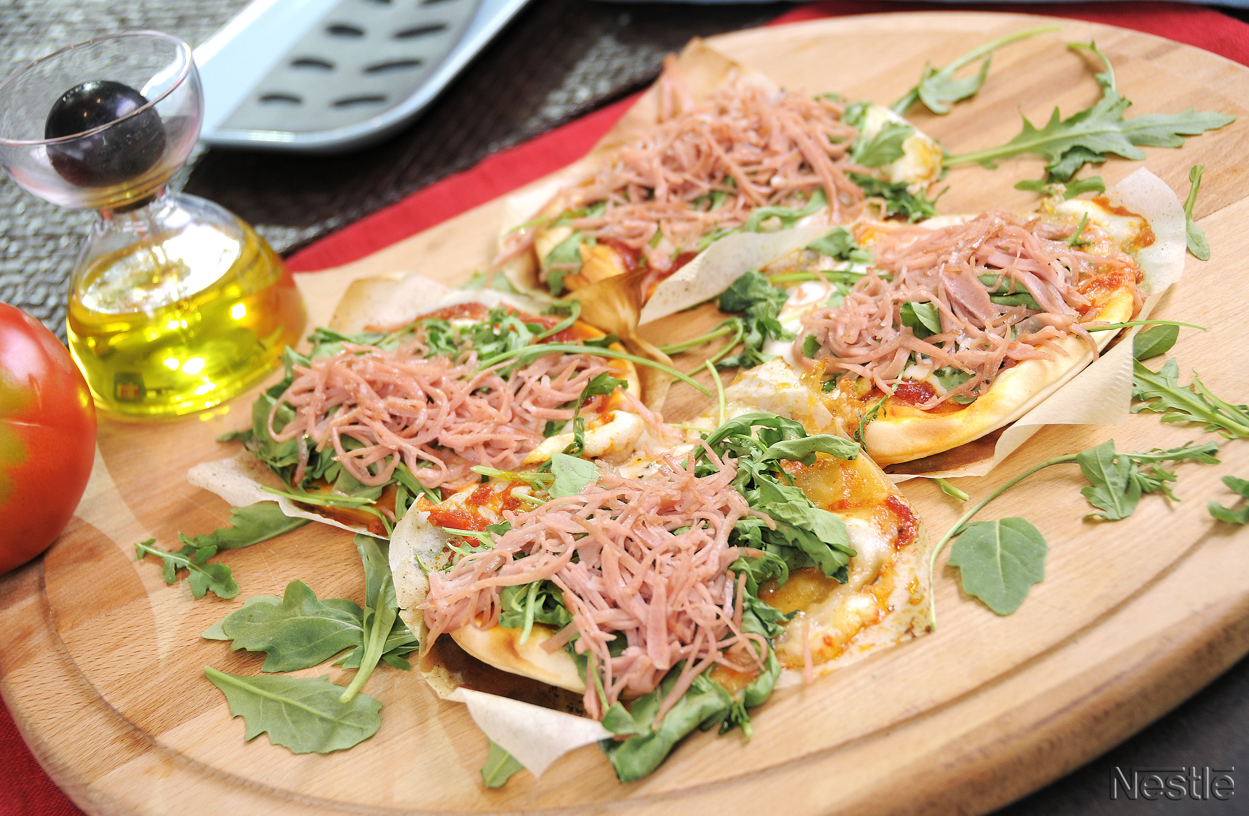 Pizzetas de mortadela y rúcula