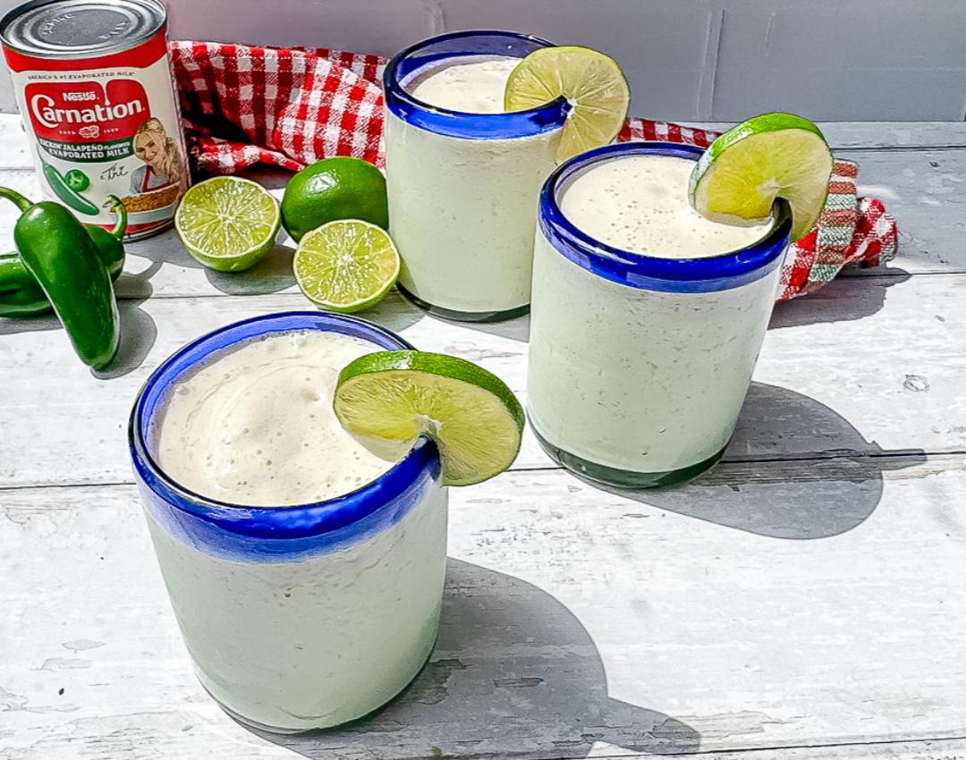 Spicy Margarita Milkshake by CARNATION® MILKS, with Kickin' Jalapeño Evaporated Milk, garnished with lime and chili powder.