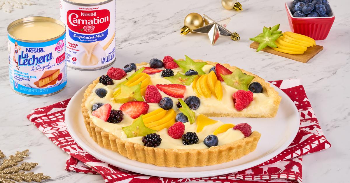 Fruit Tart by Official LA LECHERA®, with a crisp base, creamy filling, and fresh berries.