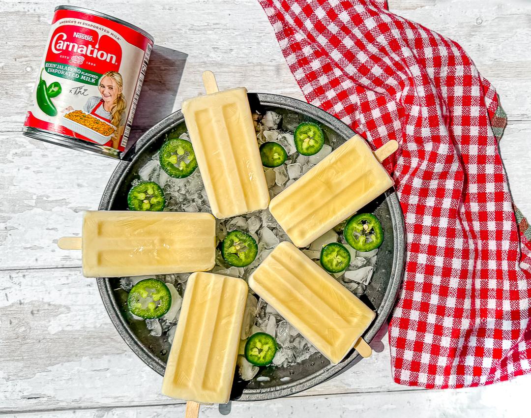 Swicy Popsicles by CARNATION®: Jalapeño Flavored Evaporated Milk and La Lechera® Sweetened Condensed Milk on sticks.