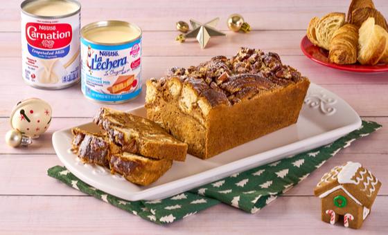Dulce de Leche Bread Pudding by LA LECHERA®, made with CARNATION® Evaporated Milk, topped with caramel sauce.