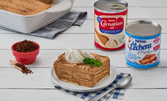 Carlota de Café by LA LECHERA®, with NESCAFÉ® coffee, condensed milk, cookies, and whipped cream.