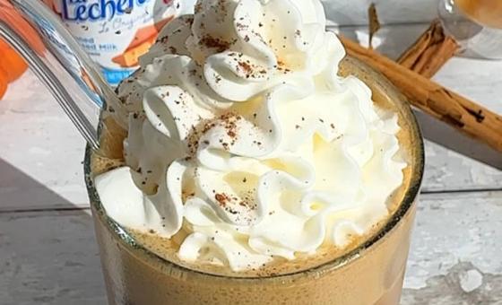 Iced Spanish Pumpkin Latte with La Lechera Sweetened Condensed Milk, ice, and pumpkin spice garnish.