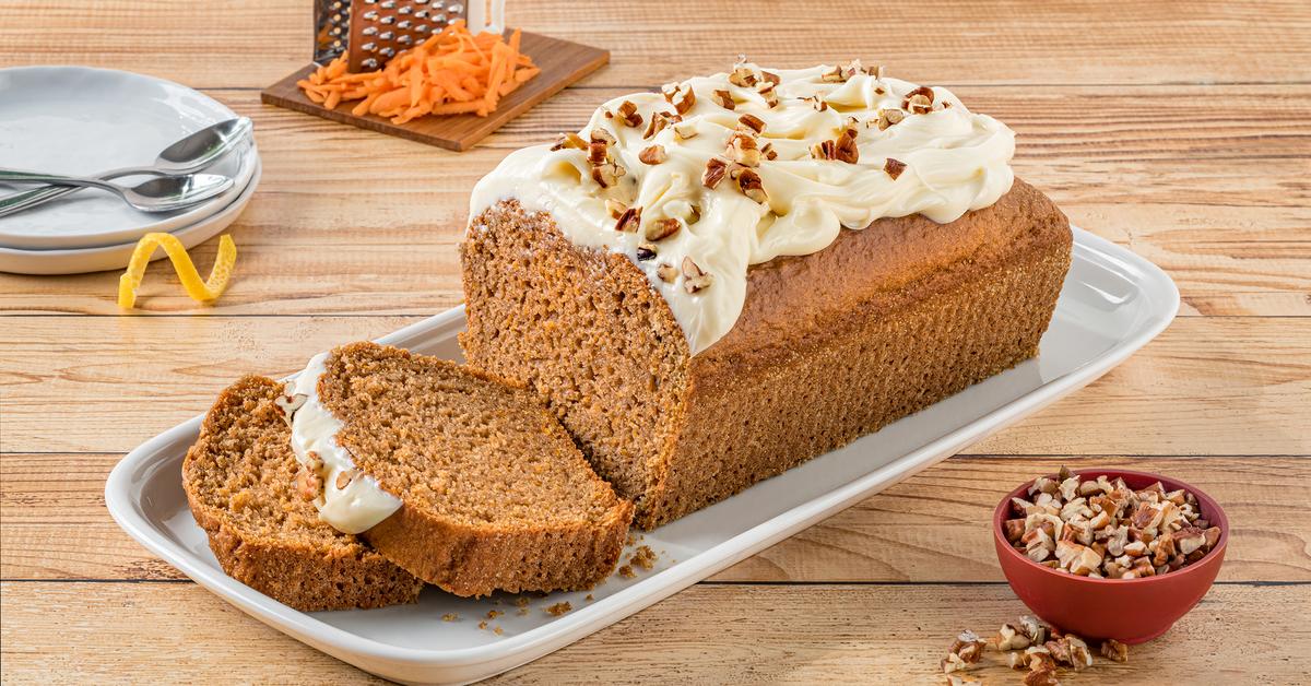 Carrot Pound Cake by LA LECHERA®, made with CARNATION® Evaporated Milk, topped with cream cheese frosting.