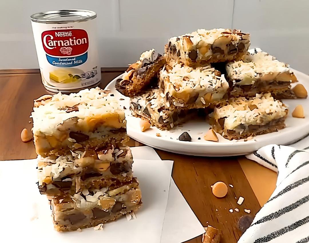 Chocolate Chip Magic Bars by CARNATION®, with layers of chocolate chip dough, mini morsels, and sweetened condensed milk.